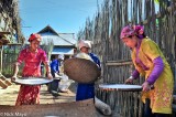 Three Girls Winnowing Rice