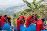 Four Women In Red Tassled Hats