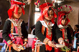 Black Dao Bridesmaid Offering Drinks