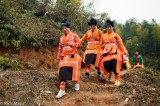 Three Women Dressed In Orange