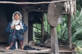 Akha Woman On Her Porch