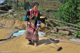 Raking Rice On A Mat