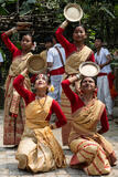 Girls Holding Kahi In Bihu Dance
