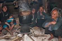 Family Around The Cooking Pot