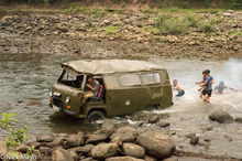 Battered Vehicle Crossing River
