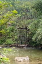 Water Wheel On A Placid River