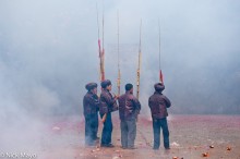 Pipers Amid Firecracker Smoke