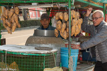 Sweet Potato Vendor With Friend