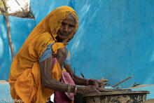 Lady In Orange Washing Dishes