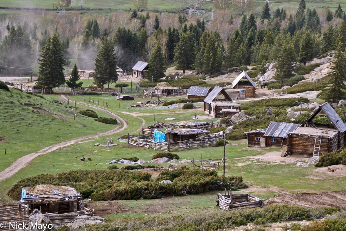 Wooden cabins and animal pens in the Tuva village of Tierekiri.