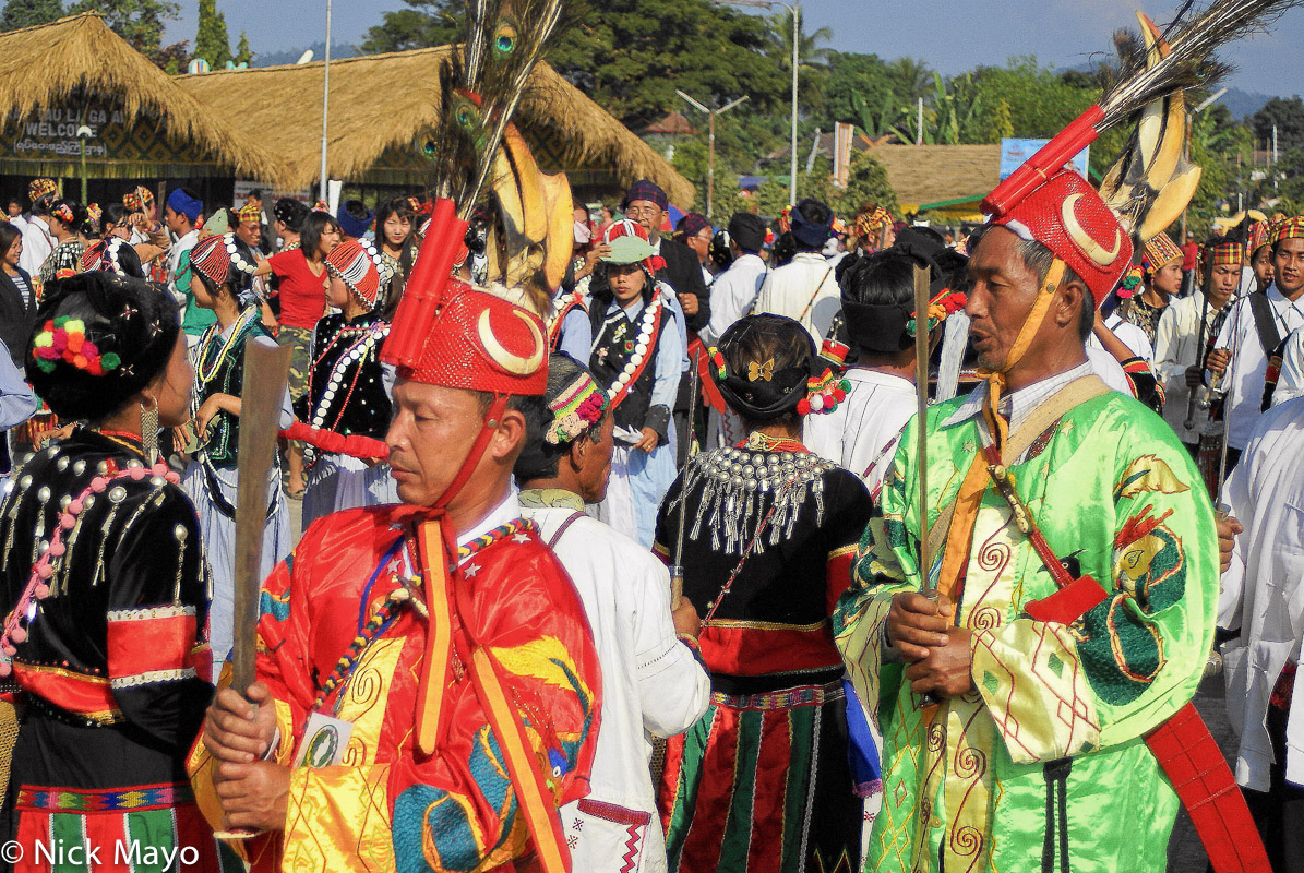 Jingpo men wearing traditional clothes and hats participating in the annual Munao festival in Myitkinya.