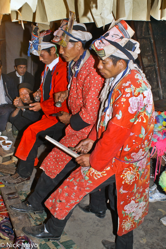 Yao priests (sai mienh) ringing hand bells at a dujie coming of age ceremony in Gung Jie Po.