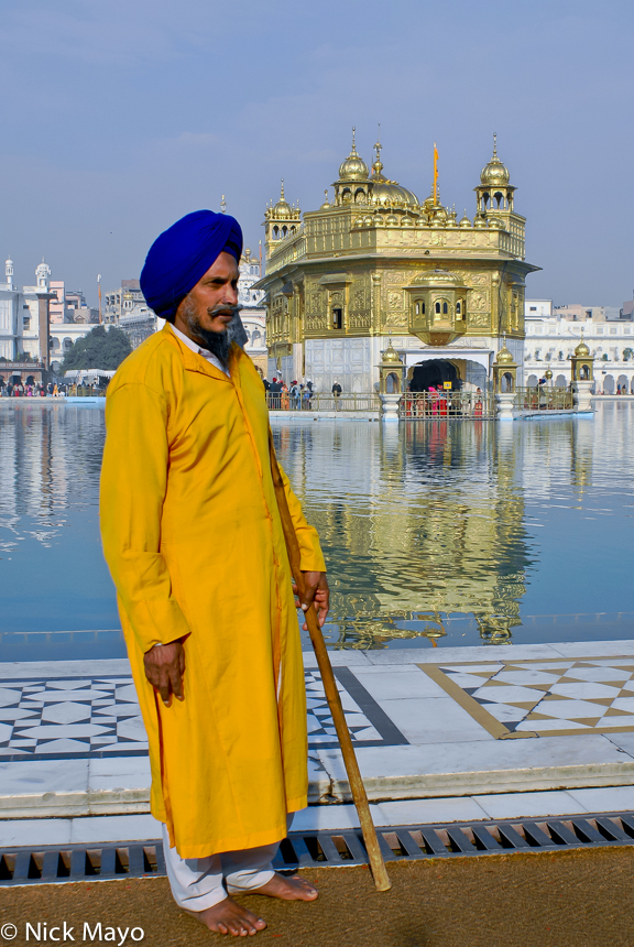 A Sikh attendant/guard in a blue turban at the Golden Temple in Amritsar.