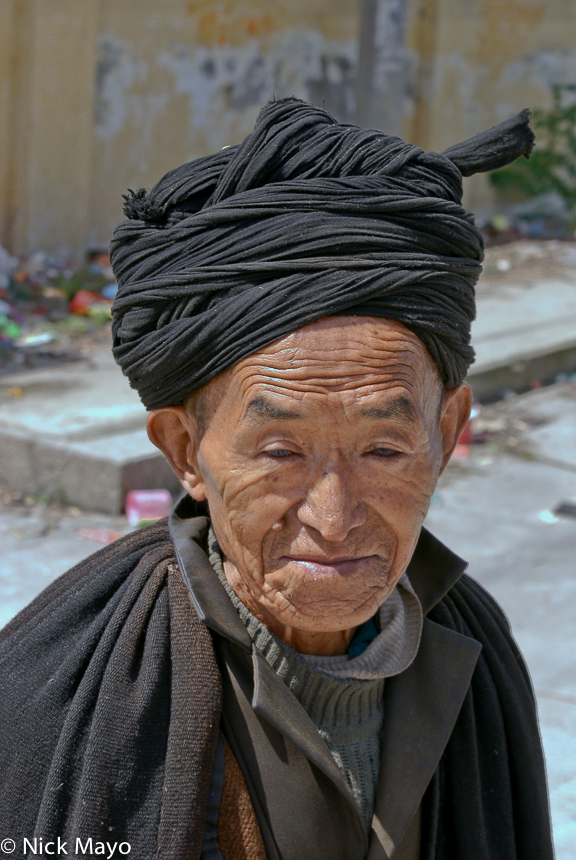 A Yi man of Tu Wu village wearing a traditional turban.