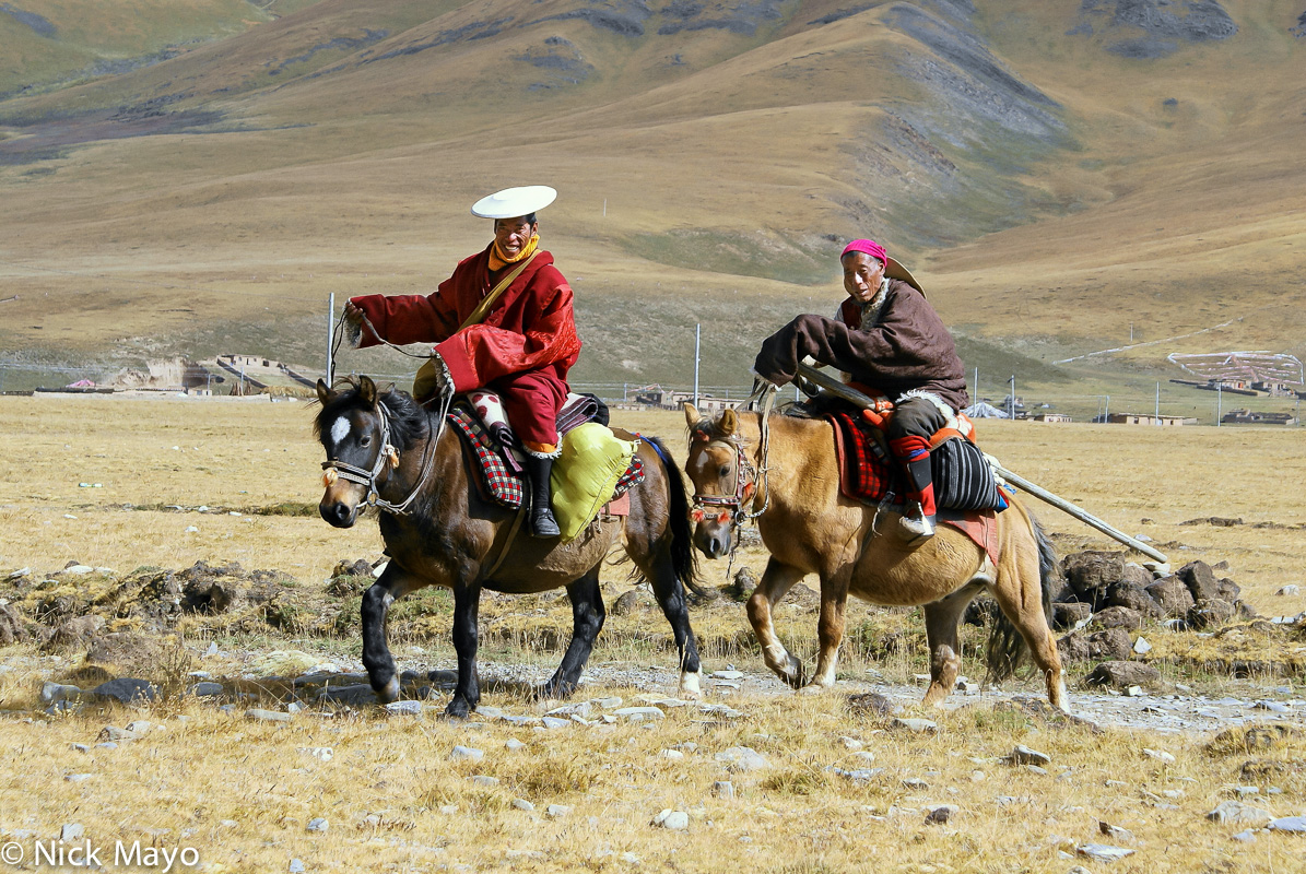 A Tibetan monk and his companion on horseback near Arikdza.