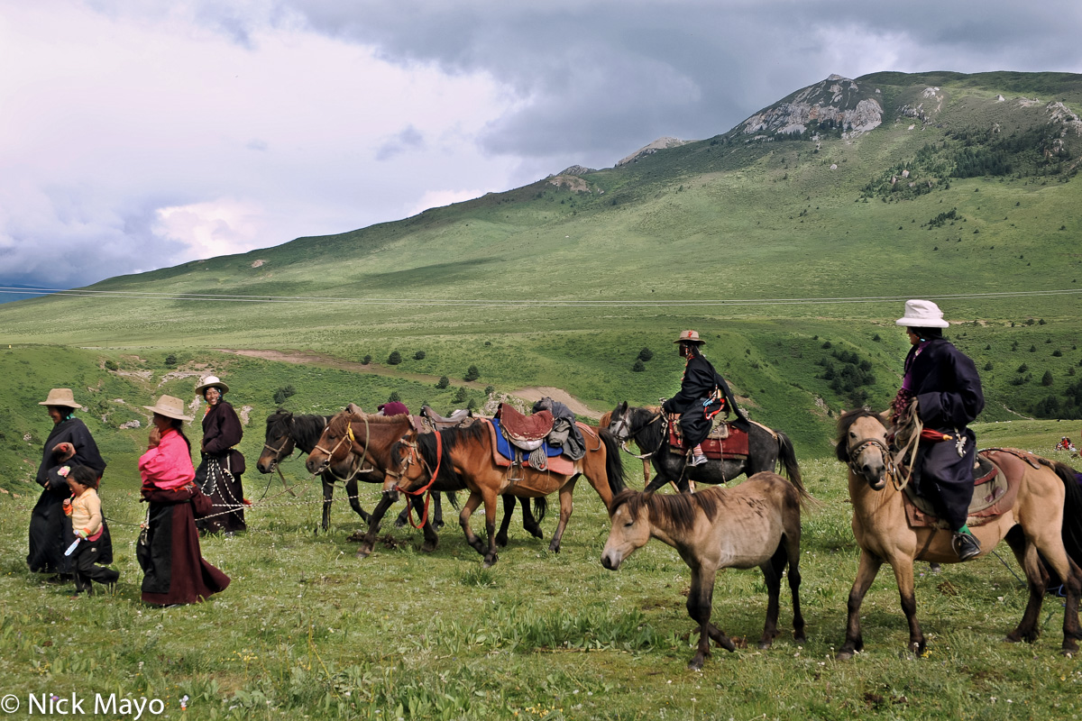 A group of Tibetans leaving with their horses from a monastery festival in Manigango.