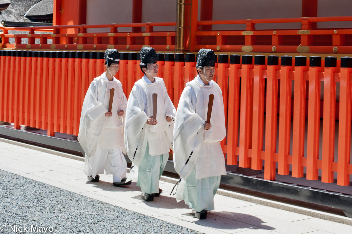 Three priests at the Fushimi Inari Shrine.