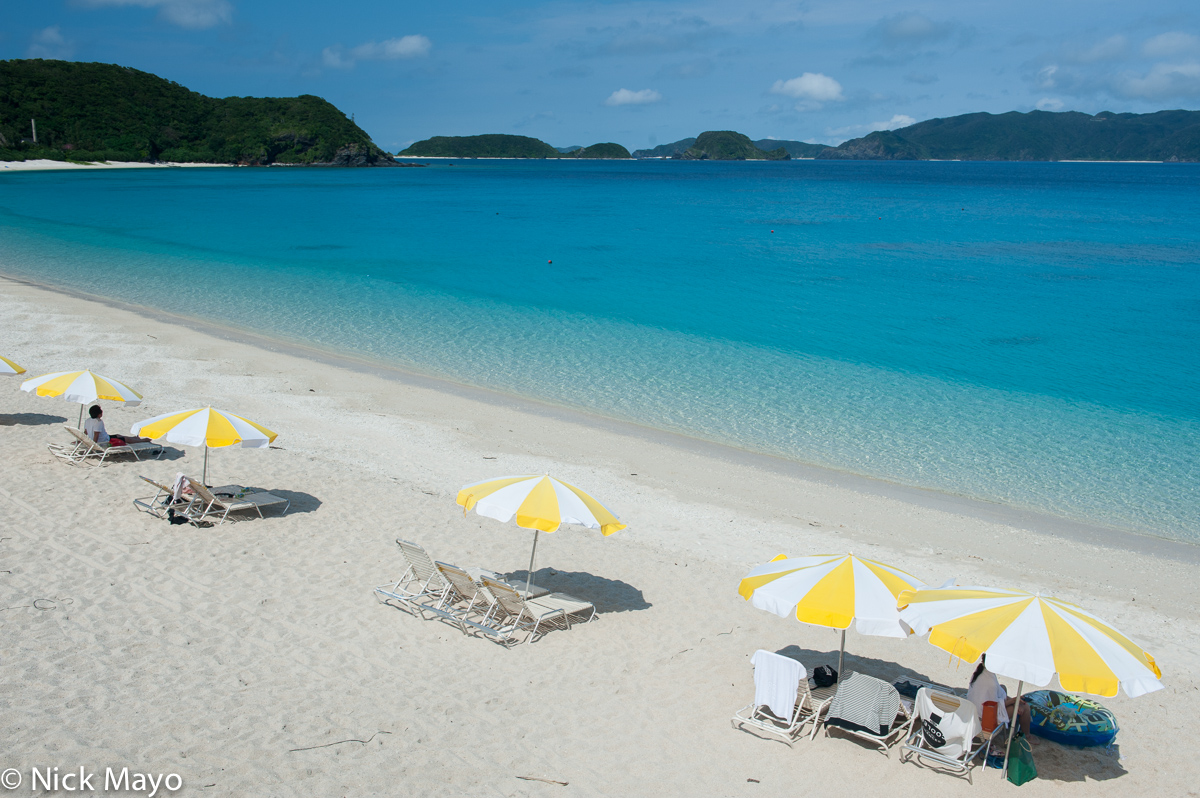 Parasols on the main white sand beach on the island of Zamami.