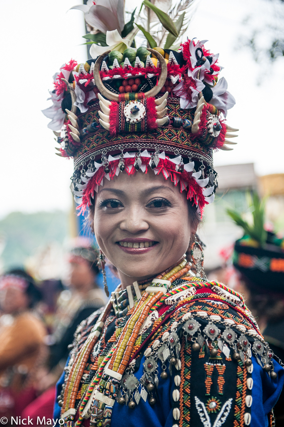 A Rukai bride, wearing a traditional hat, necklace and earrings, at a wedding in Wutai.