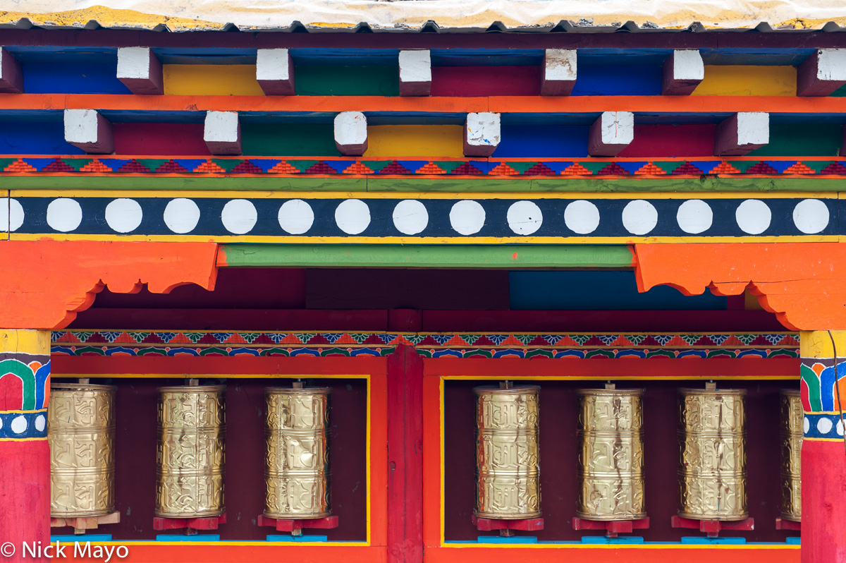 Prayer wheels set into a wall at Zaxi Chilin.