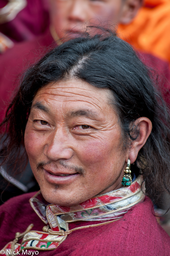 A Tibetan Khampa man at a festival in Manigango.