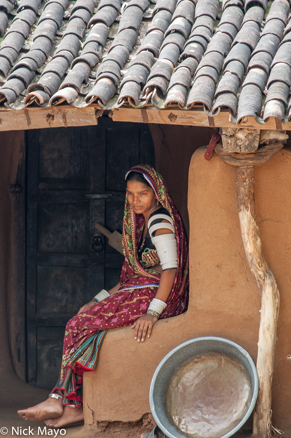 A Rabari woman in the doorway of her house in the village of Banpur.