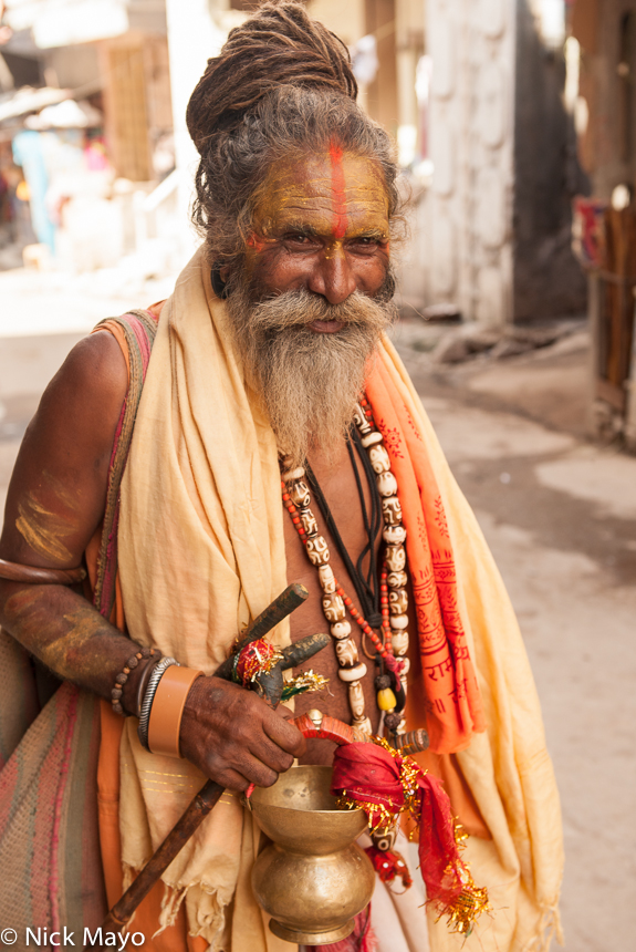 A wandering "holy" man, with uncut hair and wearing heavy necklaces and bracelets, in Ambaji.&nbsp;