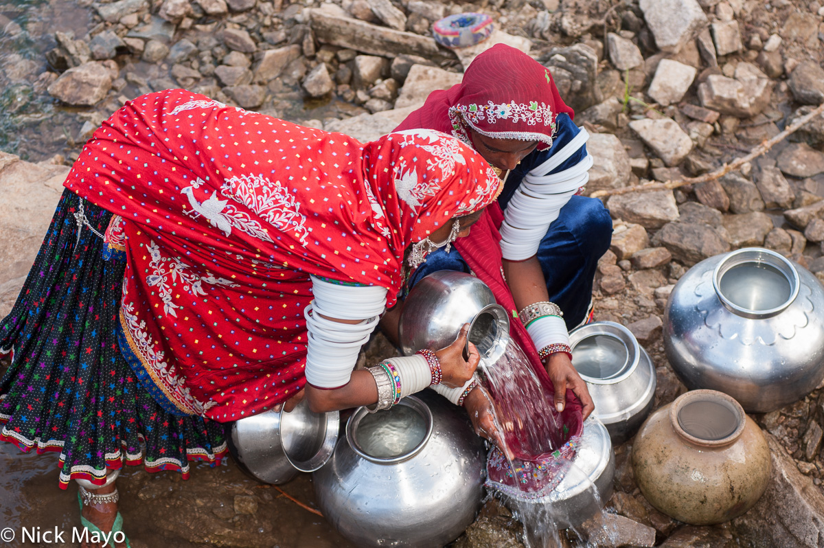 Rabari women fetching water near their campsite outside Ambaji.