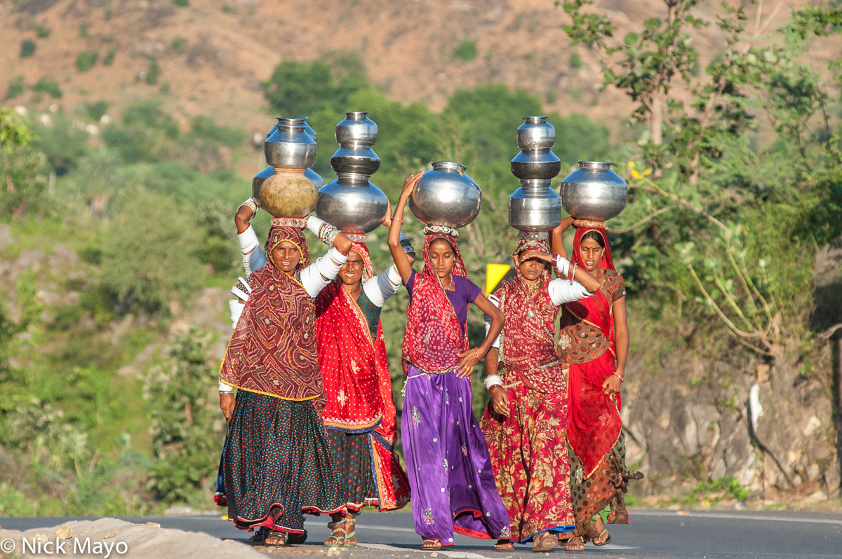 Rabari women returning to their campsite outside Ambaji after fetching water from a nearby stream.