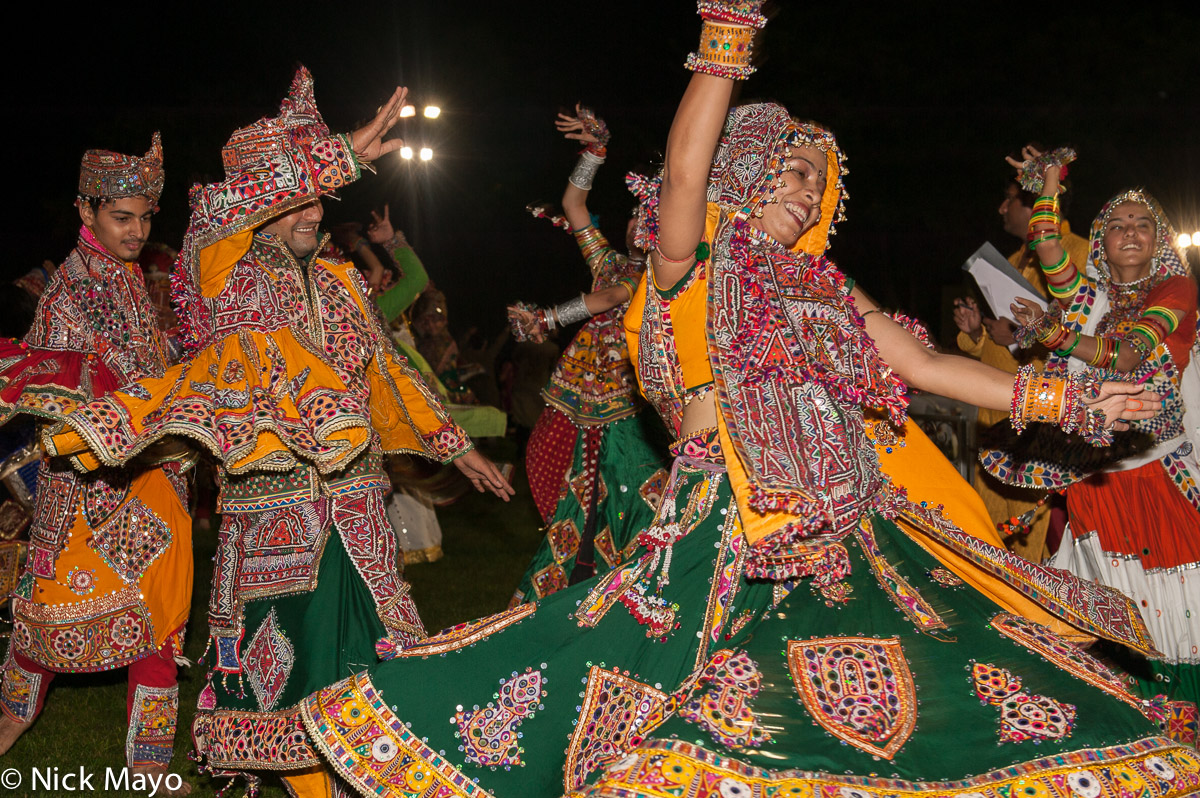 A dancer, wearing a head scarf and multicoloured bracelets, at a Navatri festival celebration in Ahmedabad.