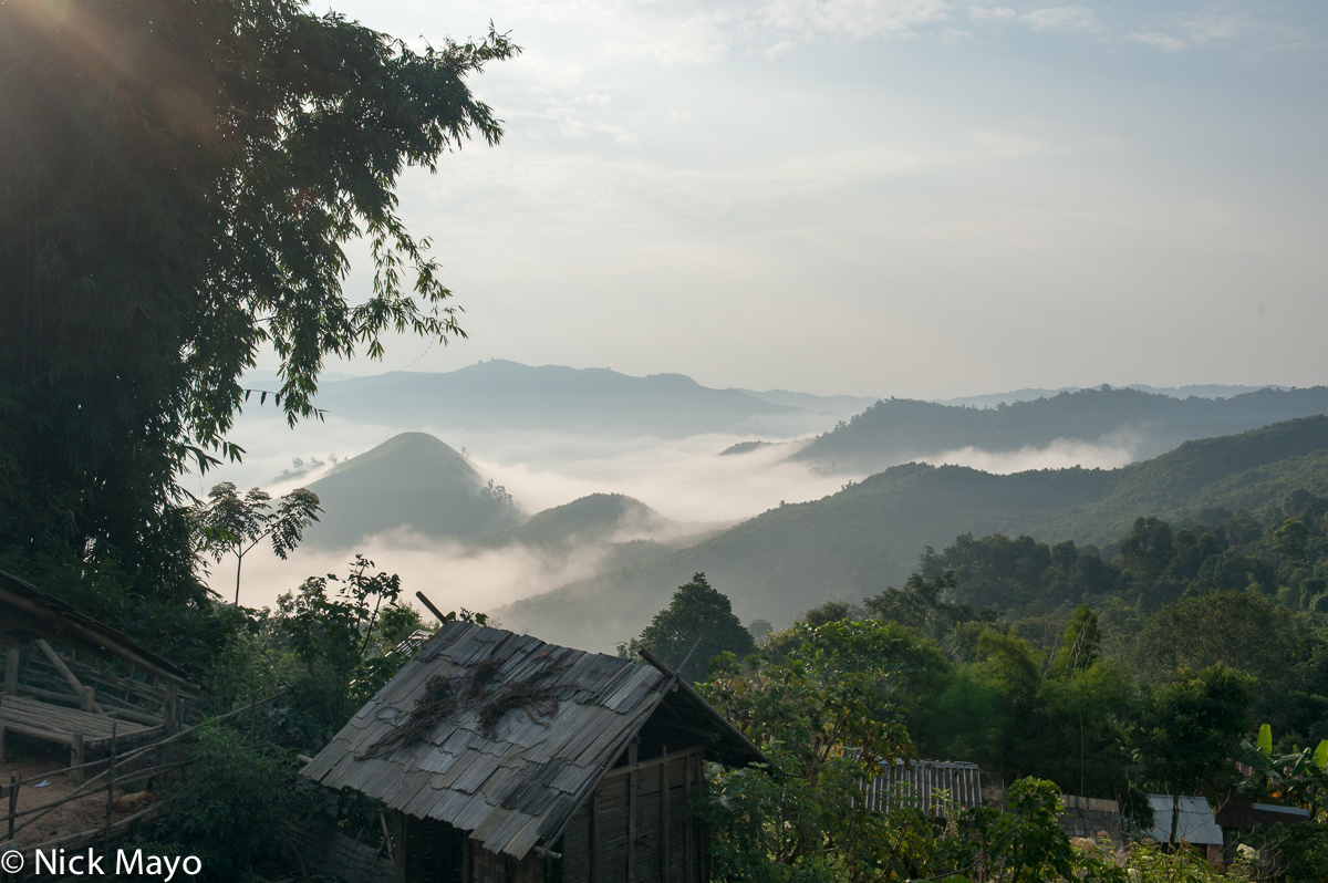 A morning view of the cloud filled valley below the Loma village of Ban Mokok.