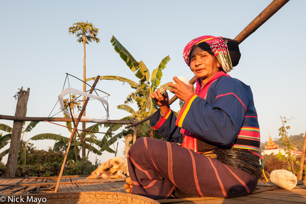 A Palaung woman spinning thread on a hand operated spindle in the village of Namgyen.