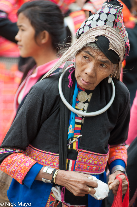 A Pala woman wearing a traditional turban, necklace and bracelets at Paknamnoy market.