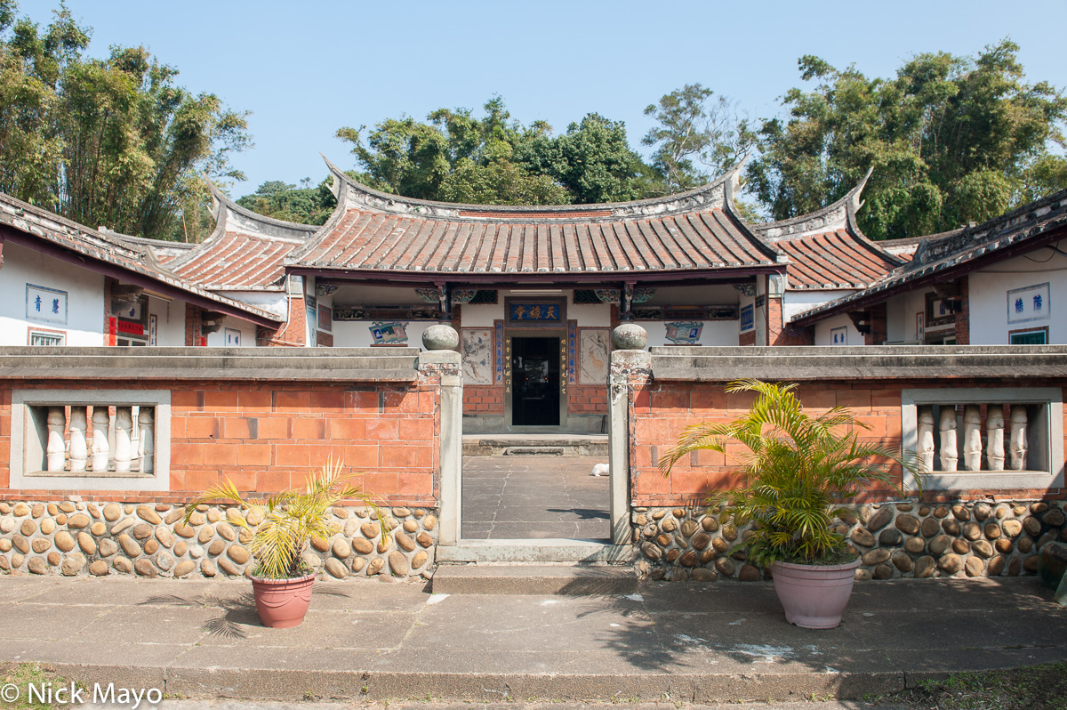 A traditional swallow tail roofed courtyard farmhouse of a Hakka family near Xinpu.