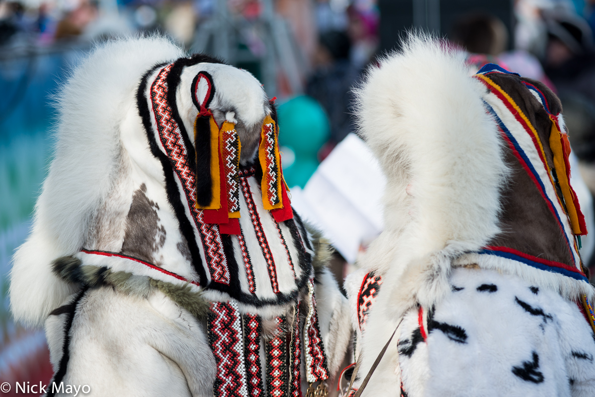 Two Nenets women dressed in their best yagushkas with decorative backpieces at a festival in Yar Sale on the Yamal peninsula...