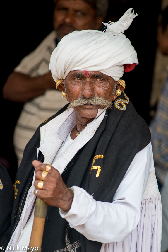 A Rabari man, wearing a turban and earrings, at the Vondh fair in Kutch.