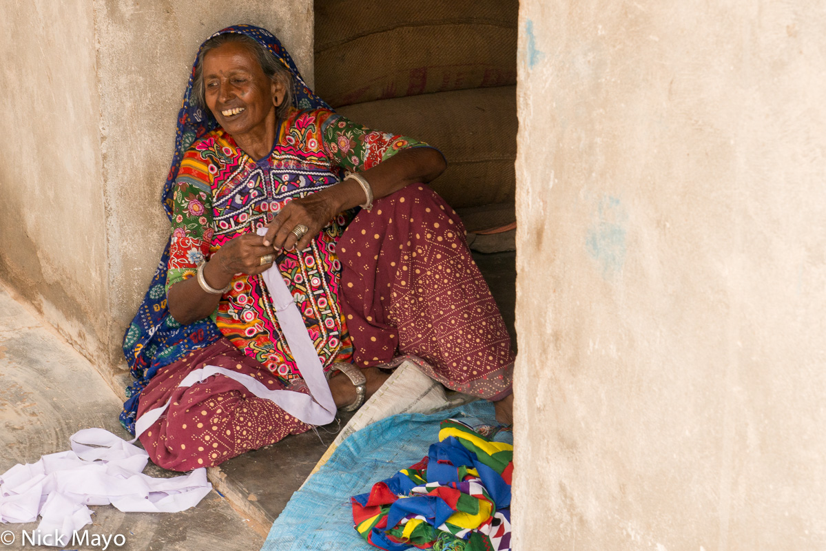A Meghwal woman seated in the doorway of her bunga in the Kutch village of Dholavira.