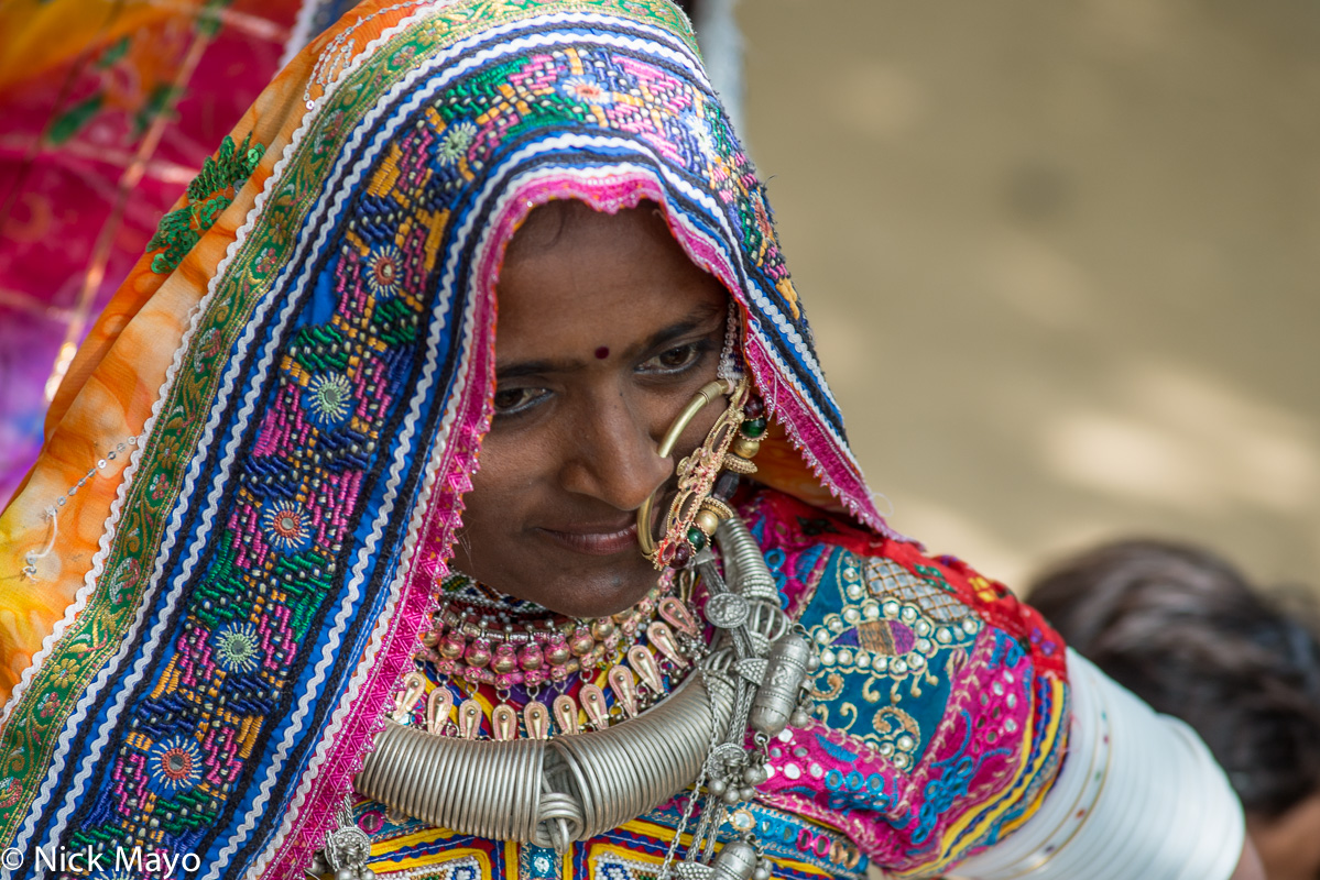 A Meghwal woman, wearing a head scarf, nose ring and heavy necklace, at the Saang Wari fair in Ratanpar, Kutch.