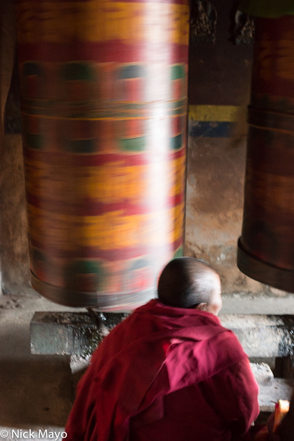 A Monpa nun spinning a prayer wheel during the Torgya festival at the Tawang monastery.