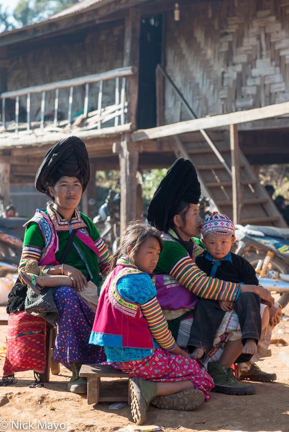 White Hmong women with their children during a festival in the village of Ban Hong.