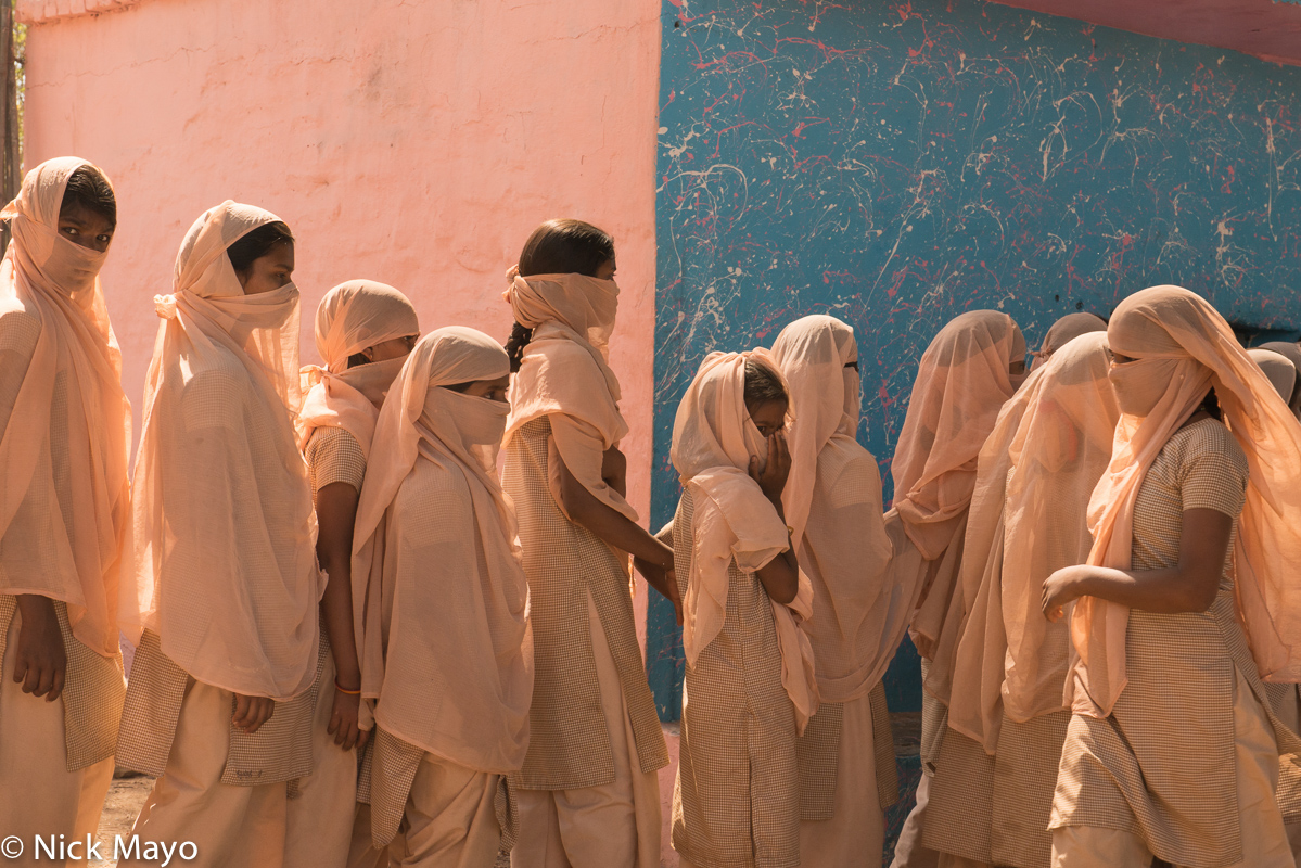 Adivasi schoolgirls at the Chitra-Vichitra temple near Gunbhakhari village during the annual mela.