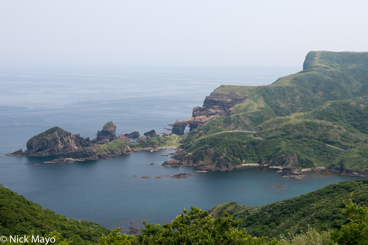 View from the Akao lookout over Matengai cliff and the Tsutenkyo sea arch on Nishinoshima in the Oki Islands.