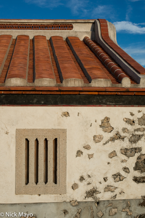 Window and roof of a traditional house on Chimei island.