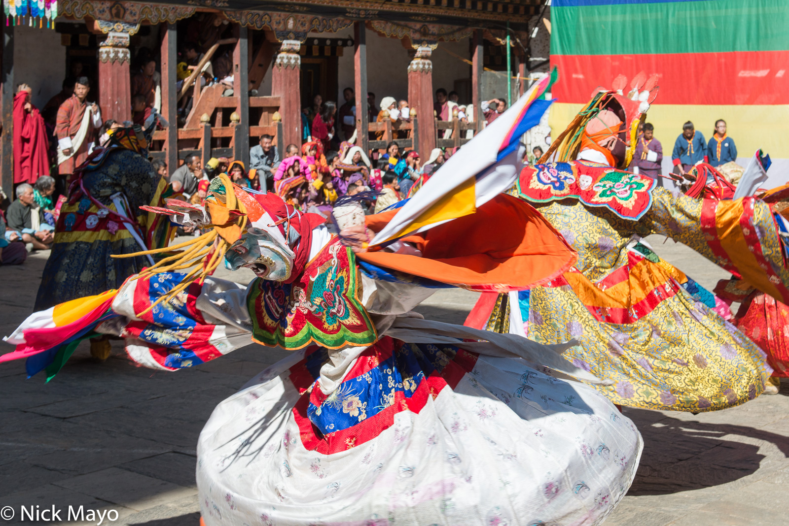 Masked monks dancing at the tshechu at Trashigang.