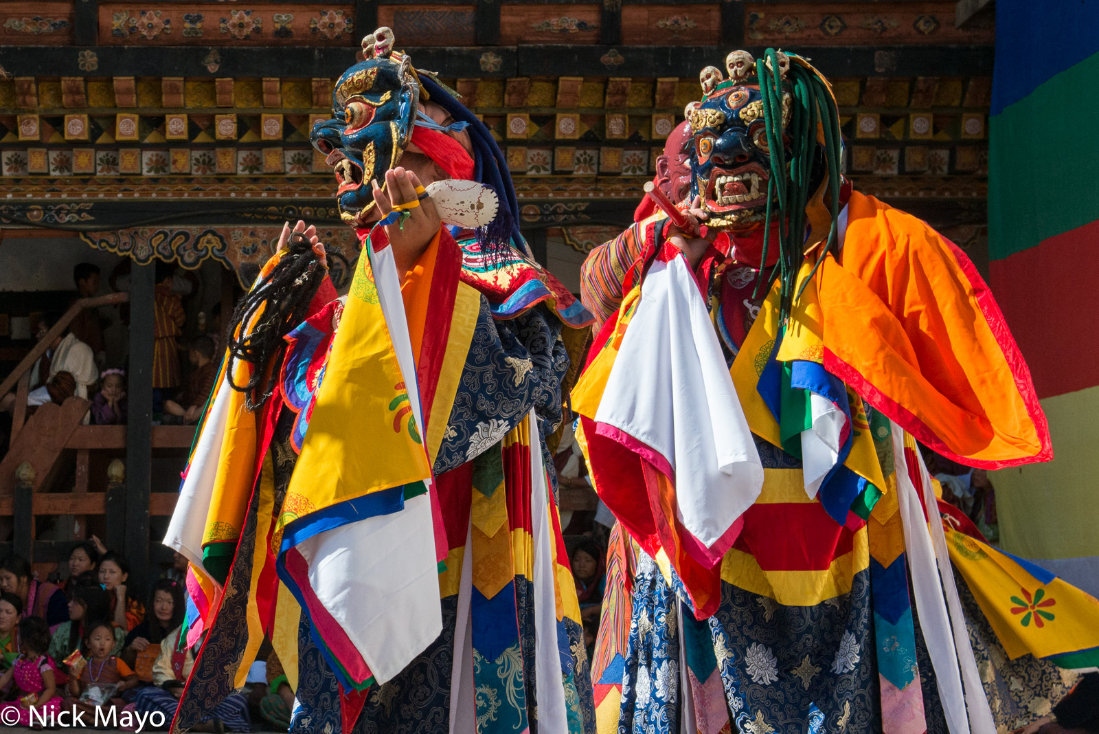 Two masked monks dancing during the Trashigang tshechu.