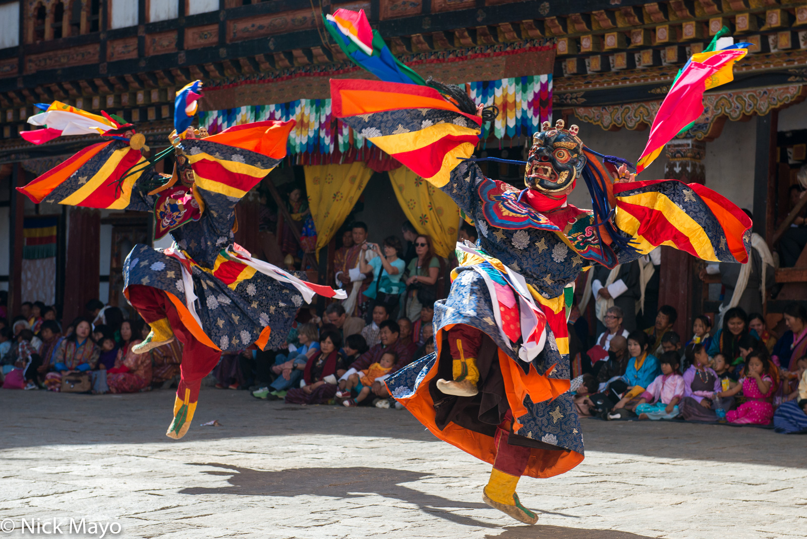 Two masked monks dancing at the annual tshechu at Trashigang dzong.