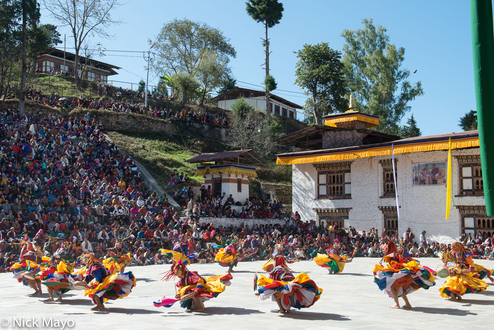 Masked monks dancing at the tshechu at Mongar dzong.