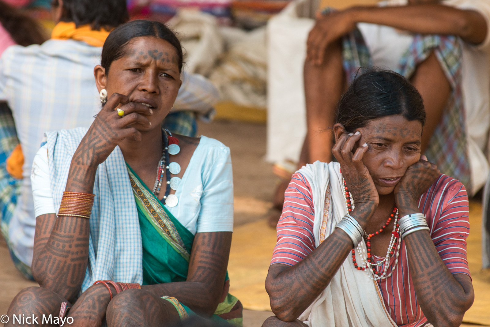 Two tattooed Baiga women resting at Taragaon.