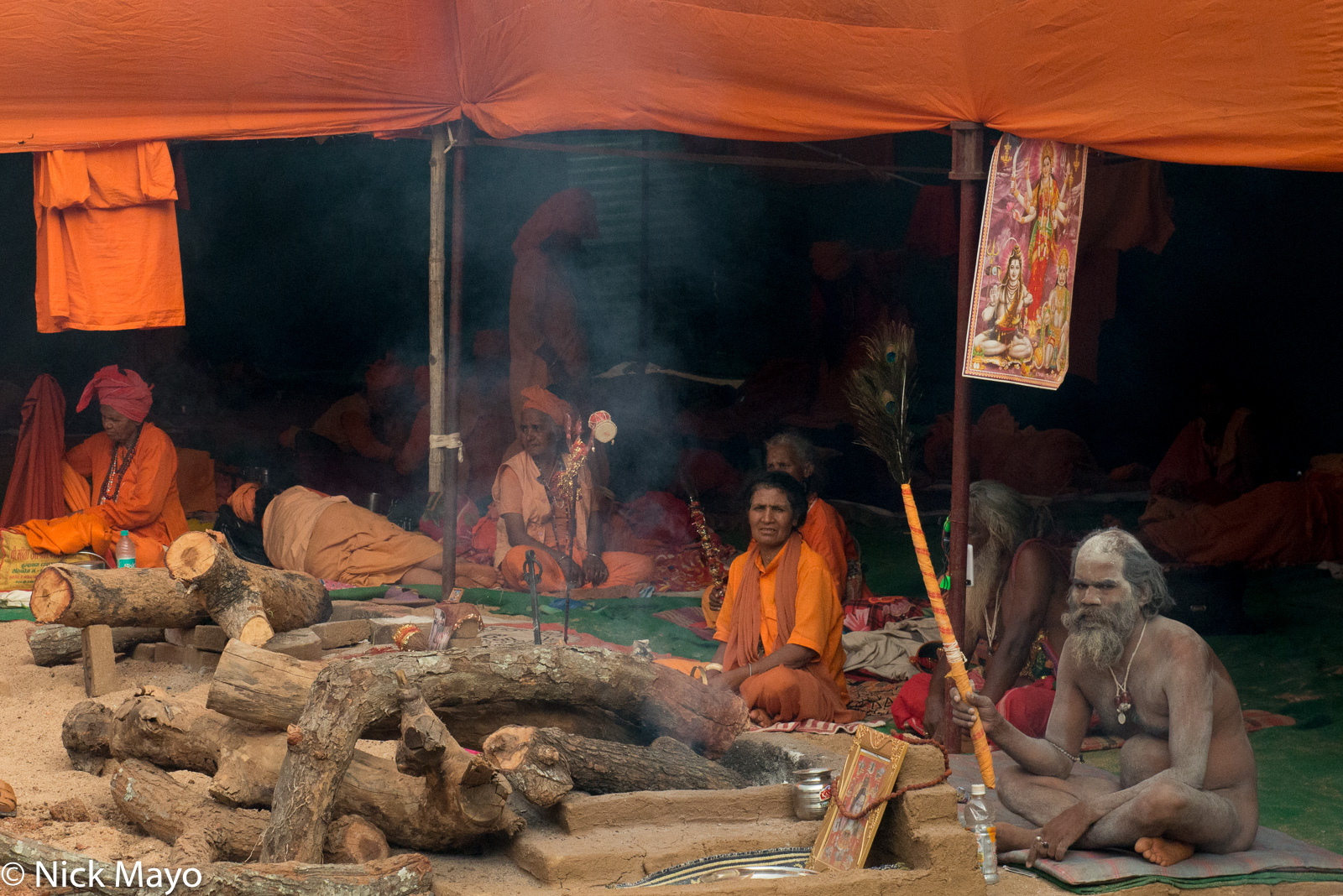 Sadhus and their female counterparts, sadhvis, in their camp at the Shivaratri festival at Rajim.