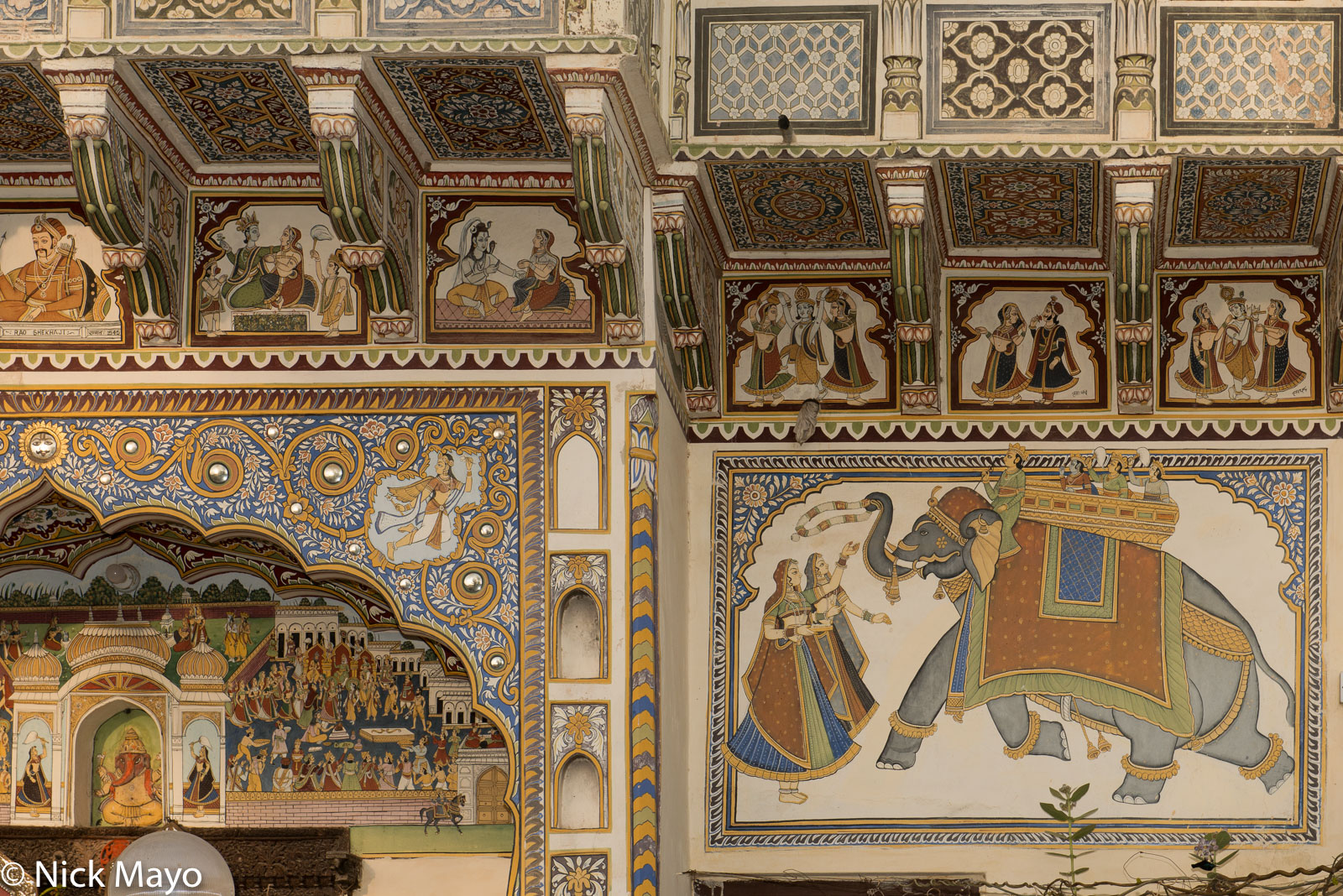 Murals on the wall of a Mandawa haveli.